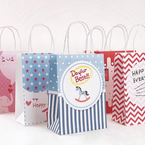 Colorful cartoon kraft paper gift bags with handles and diverse patterns for parties