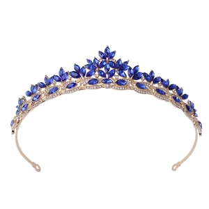 Golden bridal crown with blue crystal leaves and rhinestones for wedding hairstyles