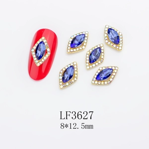 Detailed macro view of 8x12.5mm navy blue marquise rhinestones with gold alloy casing