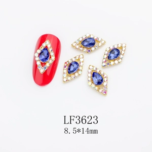 Macro view of blue teardrop crystal in diamond alloy frame for nail art decoration