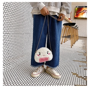 Detail view of cute plush rice ball crossbody bag with pink decor and gold chain strap