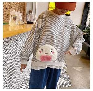 Detail of cute rice ball plush crossbody bag with embroidery and gold chain strap