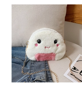 Close-up of white plush ball crossbody bag with cute embroidery and gold chain strap