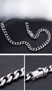 Detailed macro view of 13mm thick stainless steel Cuban link chain with secure buckle
