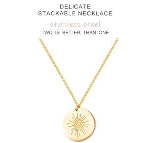 Macro detail of golden stainless steel sunburst evil eye pendant with ripple texture