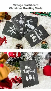Macro detail of retro chalkboard Christmas cards with festive pine cones and berries