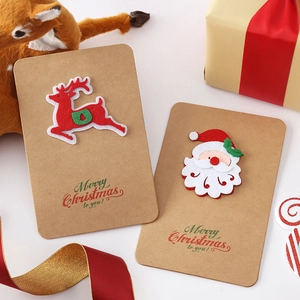 Handmade kraft Christmas cards with reindeer and Santa felt patches and envelopes
