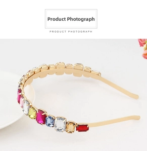 Close-up of golden metal headband with colorful rectangular rhinestones and retro design