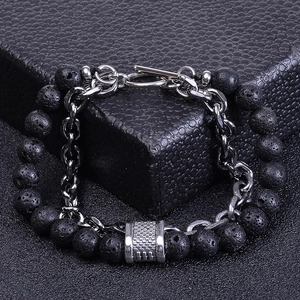 Detail of natural black lava stone bracelet with stainless steel chain and T-bar clasp