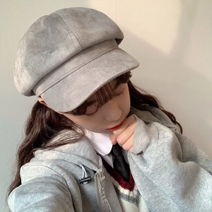 Detailed texture of grey octagonal newsboy cap showing soft brushed suede material