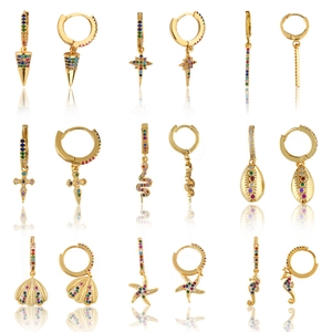 Detailed set of nine gold hoop earrings featuring colorful zircons and ocean-themed charms