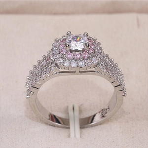 Macro shot of S925 silver ring featuring a large center diamond and pink zircon halo