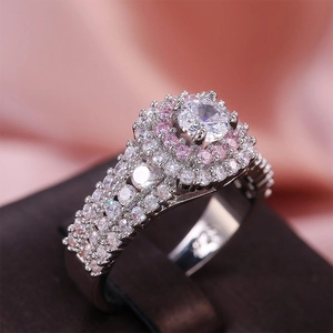 Macro shot of silver princess ring with pink halo and micro-pave simulated diamonds