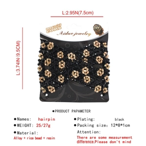 Detail of magic hair comb with black and gold beads on card packaging for styling