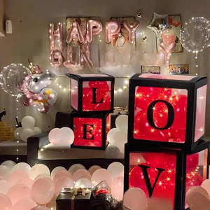 Transparent party balloon boxes with LOVE letters and warm LED lights for birthday decor