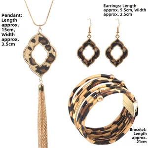 Leopard print jewelry set featuring tassel necklace, floral earrings, and layered bracelet