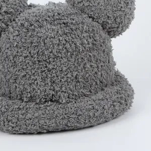 Close-up of grey plush teddy bear ears hat showing soft sherpa wool texture and detail