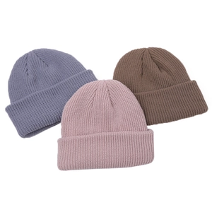 Three rib-knitted beanie hats in blue, pink, and brown with classic cuffed design