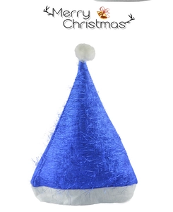 Close-up of blue sequin Christmas hat featuring a white fluffy pompom and plush trim