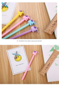 Close-up of creative cartoon elephant gel pens in yellow, pink, blue, and purple colors