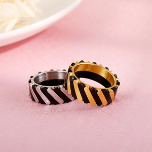 Unisex titanium steel ring with diagonal textured stripes in gold and silver finish