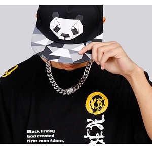 Silver stainless steel Cuban link chain necklace shown on a male model for street style