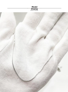 Detailed view of an S925 sterling silver curb chain necklace showing its fine texture