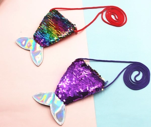 Detail view of colorful mermaid tail coin purses with reversible sequins and laser fin
