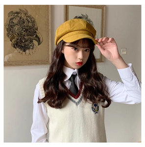 Detail view of mustard yellow newsboy hat with soft brushed suede texture and classic brim