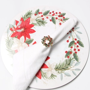 Detailed view of a gold Christmas wreath napkin ring with red and green rhinestones