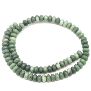 Macro shot of natural black jade abacus beads with dark green textures for DIY jewelry
