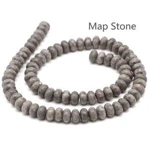 Detailed macro view of natural grey map stone beads with unique veins for jewelry making