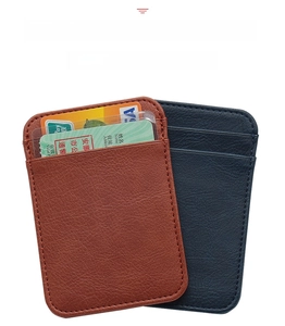 Detail of slim leather card holders in brown and navy blue with multiple slots