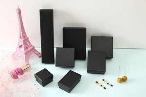 Collection of black faux leather jewelry gift boxes in various sizes for rings and necklaces