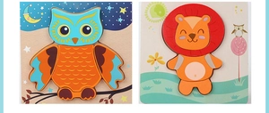 Detail of wooden puzzles for kids showing colorful lion and owl cartoon animal patterns