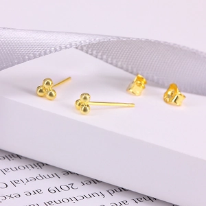 Macro view of S925 sterling silver trinity ball studs showing the 925 authenticity stamp