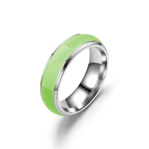 Luminous green stainless steel ring with polished silver finish on a clean white background