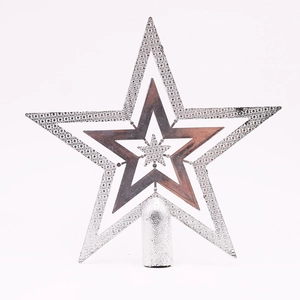 Close-up of a silver hollow-out star topper with textured metallic finish and base