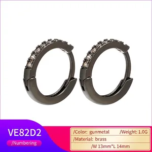 Detail of gunmetal brass hoop earrings with cubic zirconia and 13x14mm size specs