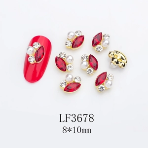 Detail of red marquise nail art charms with pearls and crystals in 8x10mm size