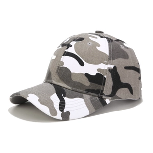 Detail view of camouflage baseball cap with grey and white patterns and breathable holes