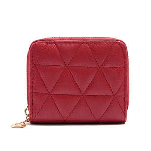 Detail of red quilted leather mini coin purse with golden zipper and stitching work