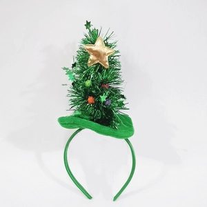 Detail view of mini Christmas tree headband with golden star and colorful pom-poms decor