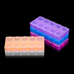 Detailed view of colorful 10-grid plastic storage boxes with independent snap lids