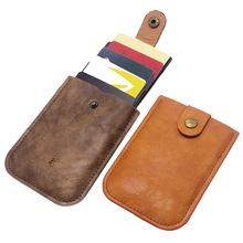 Detailed view of brown PU leather card holders with secure metal snap closures