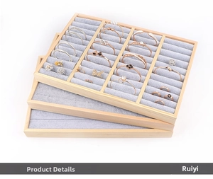 Three-tier wood jewelry display tray set with grey velvet lining for rings and bracelets
