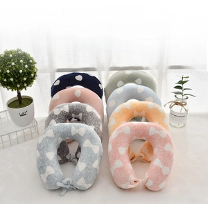 Various colors of memory foam neck pillows for kids with securing straps and patterns