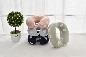 Detail of velvet U-shaped neck pillows with heart patterns and invisible zippers