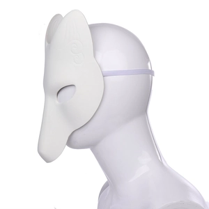 Side view of white Japanese DIY kitsune fox mask on mannequin head for cosplay events