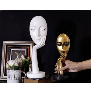 Artistic abstract resin face sculptures in matte white and gold for home decor